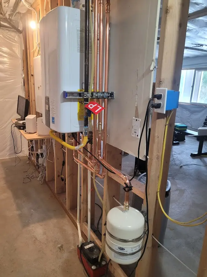Licensed plumber repairing a kitchen sink in La Crescent